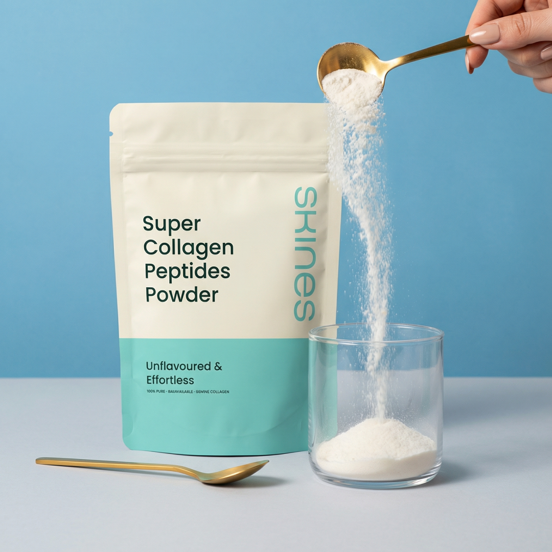 Super Collagen Peptides Powder being poured from a spoon into a glass with a Skines container in the background.