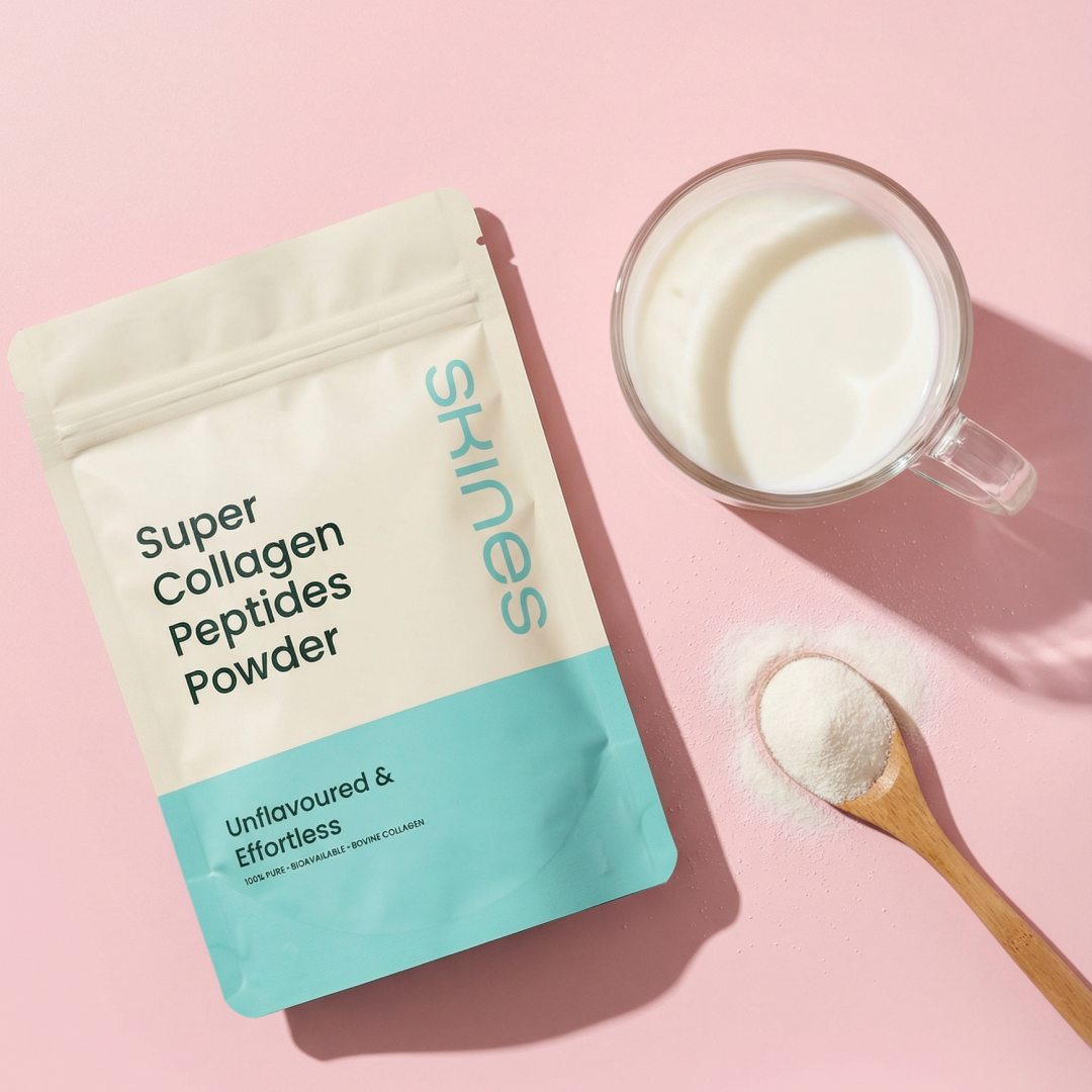 Super Collagen Peptides Powder package with a spoonful of powder and a mug on a pink background