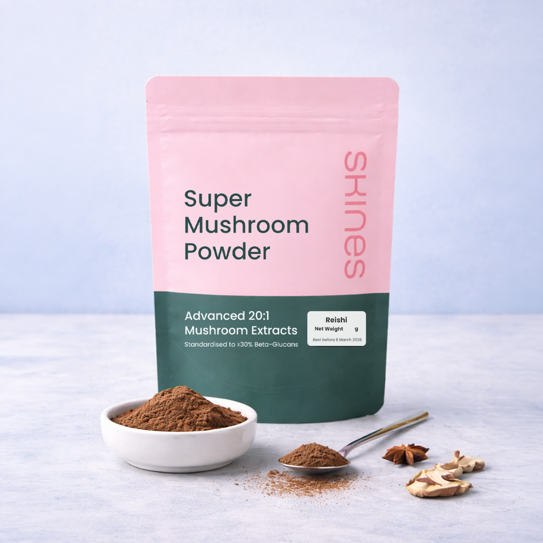 Super Mushroom Powder packaging with a bowl of powder and mushrooms on a light surface. | SKINES