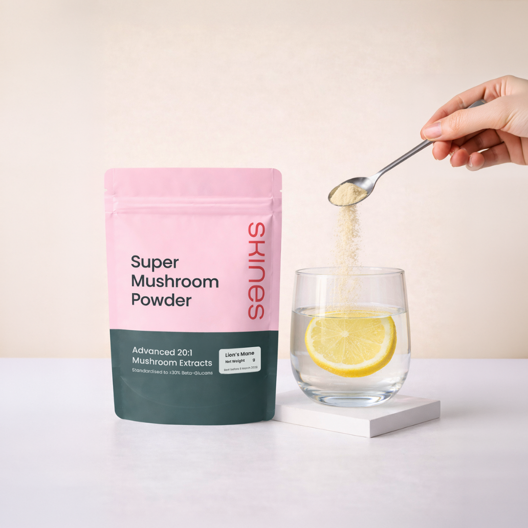 Super Mushroom Powder packaging with a glass of water and lemon, on a light background | SKINES